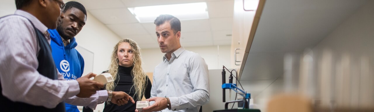 Assistant Professor, Dr. Azizur Molla, leads Master of Public Health students through a lab session on testing for radon.